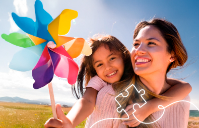 Madre e hija disfrutando de un día soleado al aire libre, representando el compromiso de FEPEP con la sostenibilidad y el bienestar de las familias.